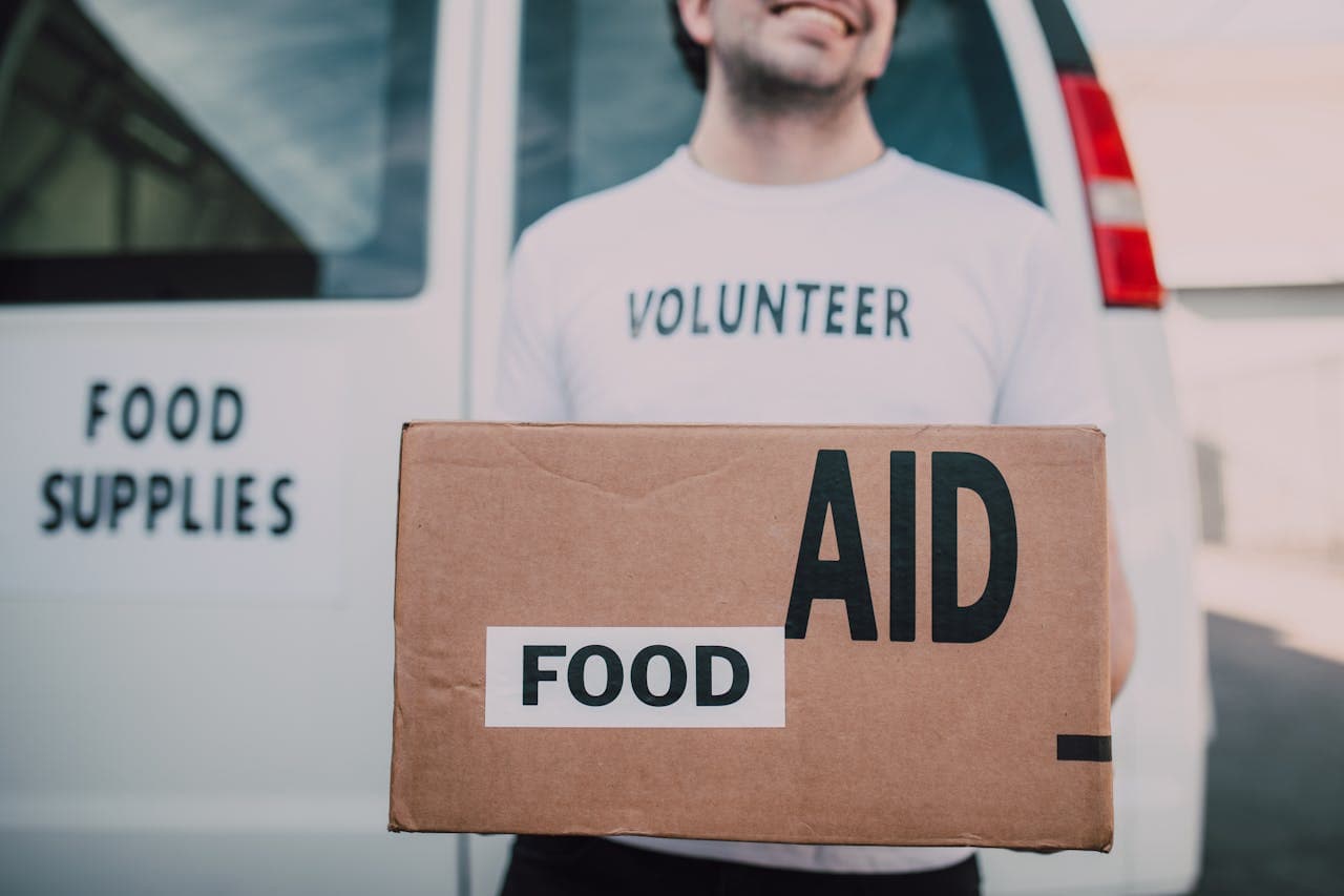 Volunteer delivering food aid in an international development programme
