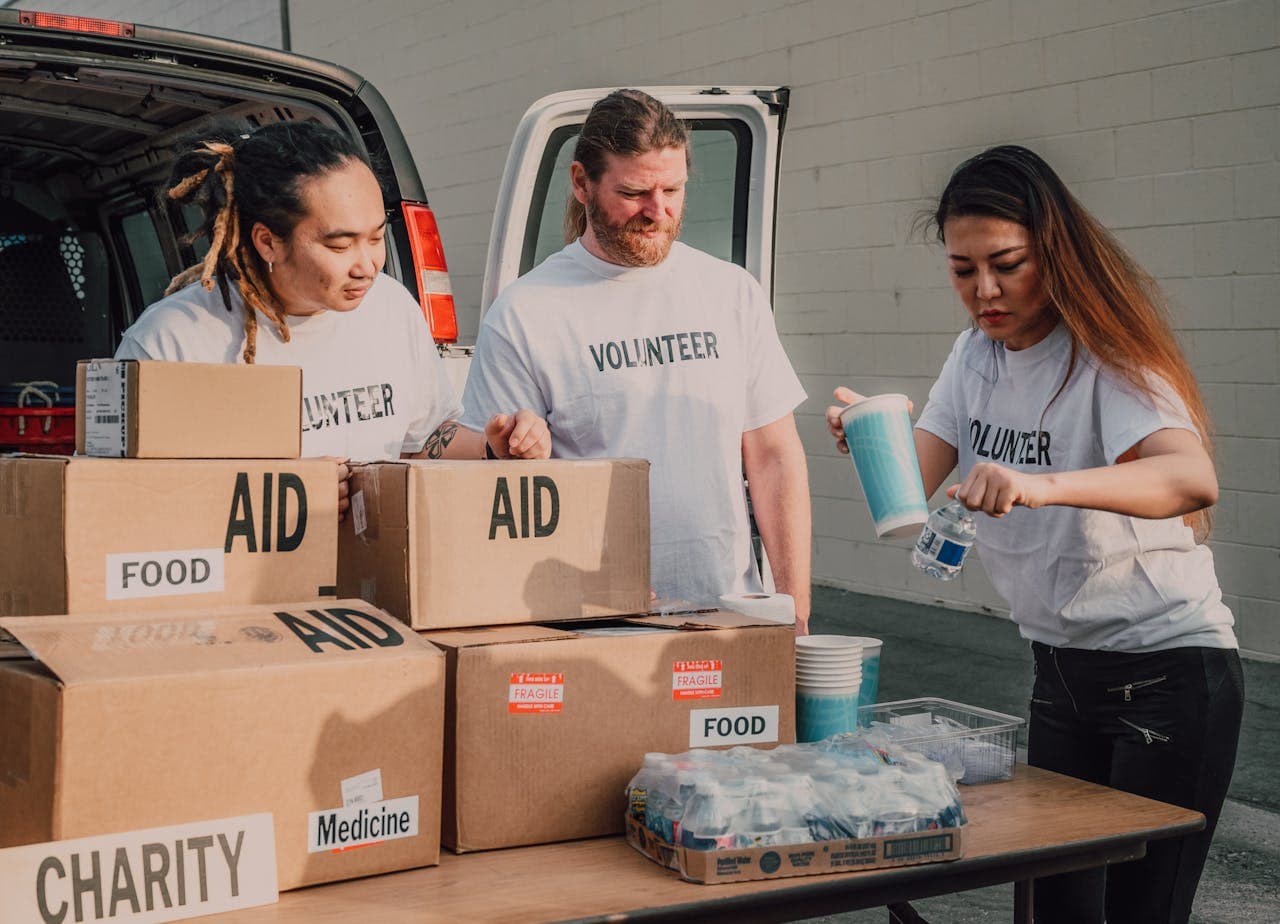 Volunteer team sorting food aid boxes for distribution